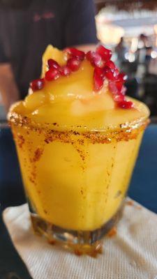 Mango Margarita comes with pomegranate seeds. Delicious!