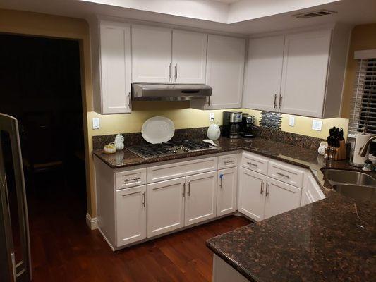 Under cabinet LED lighting added to kitchen remodel with new LED can lights overhead