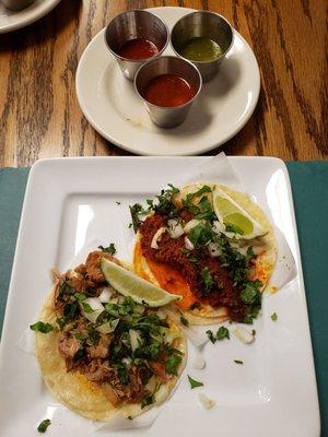 One chorizo taco and one carnitas taco