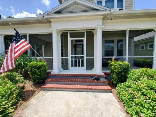 Front porch enclosed. We can build around your beautiful round columns.