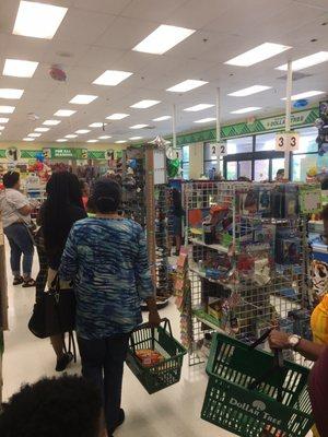 The long line wrapped down the back aisle waiting to check out.