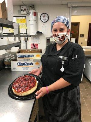 Chef Jess with one of the Kitchen's signature cheesecakes