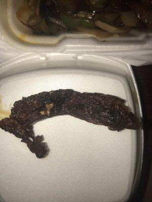 The burnt piece of steak that was completely inedible.