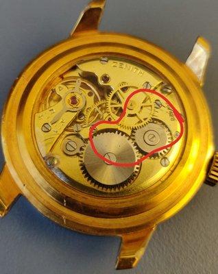 Dust attached to the back cover of the mechanism.