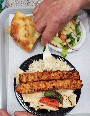 Somebody couldn't wait for the picture to be taken, of the delicious Chicken Adana Kebob Platter. I don't blame him.