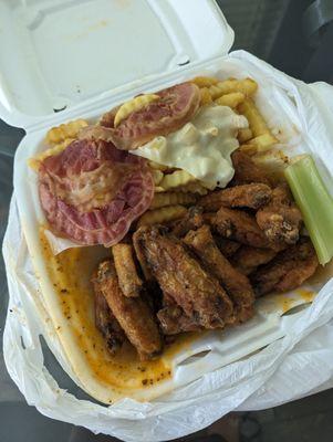 Extra wet wings with cheese and bacon fries..