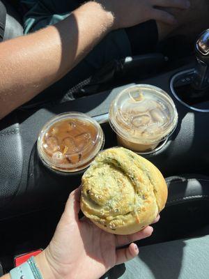 Iced coffee and spinach and artichoke roll