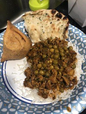 Chicken keema over basmati rice, garlic naan and veggie samosa