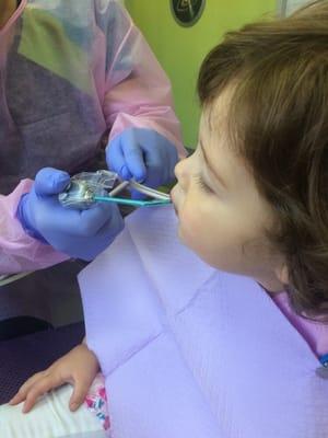 My child sitting completely still and calm at the dentist!!