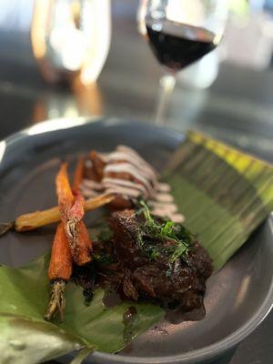 Lamb barbacoa with burnt carrot enmoladas