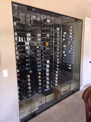 Dual doored wine storage enclosure using 3/8" tempered glass.