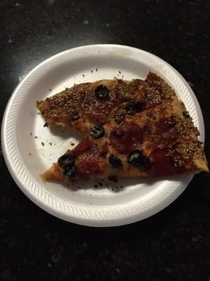 Reheated my pizza for breakfast.  Large regular crust pizza with pepperoni and black olives.  Sesame crust!!!