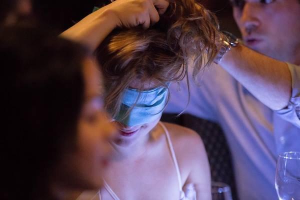 A blindfolded, aroma-enhanced wine tasting during a DEVOURED Experiential Dinner Party hosted by Joy of Romance, Inc.