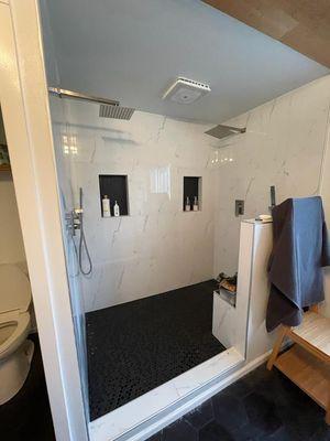 Huge walk-in shower , built in bench , double shower head