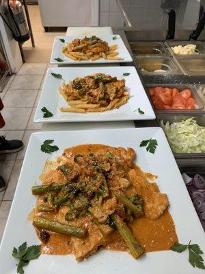 Vodka penne with asparagus and broccoli.