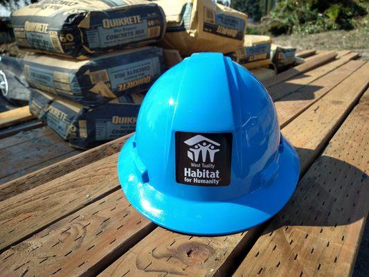 The West Tuality Habitat for Humanity logo on a hard hat