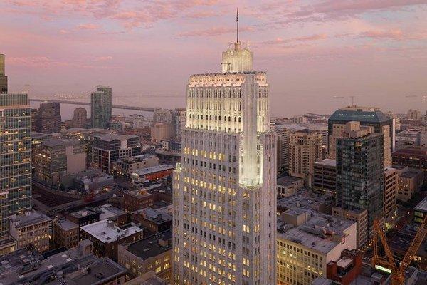 You'll have a view of the Pacific Bell building from rooftops in the city. Photo (c) Henrik Kam. Used with permission.