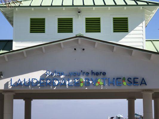 Town motto at the entrance to the beach.