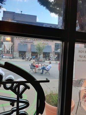 Imbibing partaking outside the shop in Bethesda Streetery.