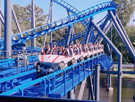 A train load of 28 riders waits for station clearance on the brake run of this Vekoma custom coaster.