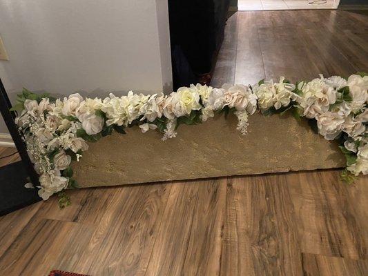 Flowers from Dollar Tree cut and trimmed and put on a styrofoam back board for the back drop of wedding ceremony