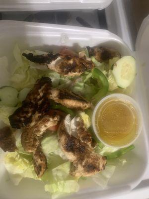 Greek Salad with grilled chicken. Think NOT. More like lettuce, two slices of cucumber and one slice of pepper with burnt chicken.