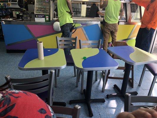 Dirty tables, Cleaning products on tables for customers to clean their own tables