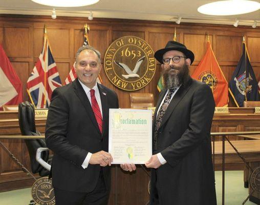 Rabbi Channa being recognized by Supervisor Joe Saladino (Town of Oyster Bay)