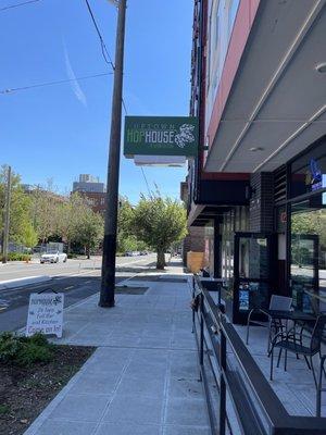 Front entrance as seen from sidewalk looking south on 1st Ave with available outdoor seating.