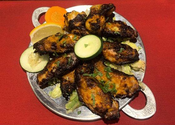 Everest Wings - Marinated in a secret blend known only to our tandoori chef then grilled in tandoor to produce a one of a kind wing dish