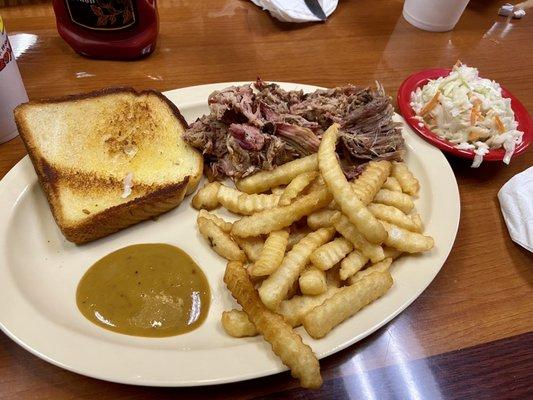 Pork plate with fries, Cole slaw, and Texas toast. Hot mustard sauce on the side.