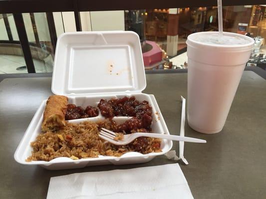 Sesame chicken, fried rice, vegetable egg roll, and a drink - $8