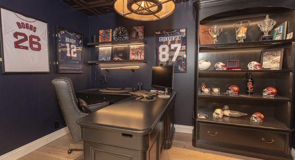 This custom office featured solid maple cabinetry with solid countertops and glass shelving.