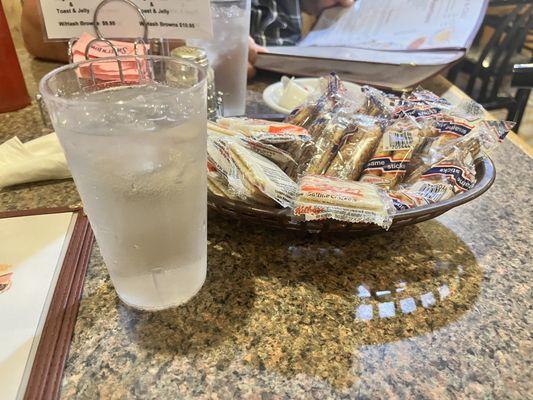 All-you-can-eat saltine cracker/sesame sticks at our table.