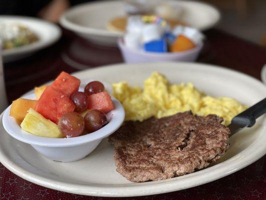 Hamburger Patty & Eggs. The fruit is fresh!