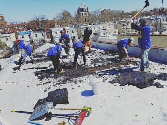 crew removing old roof