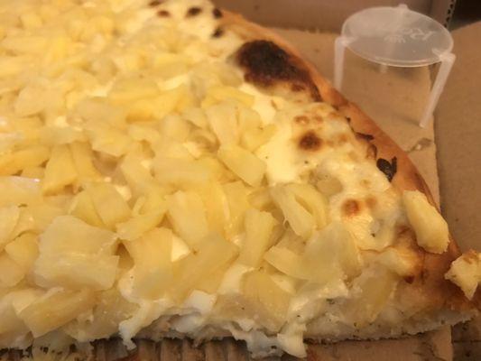 Large Half pineapple with extra pineapple on creamy garlic sauce. Don't knock it till you try it.