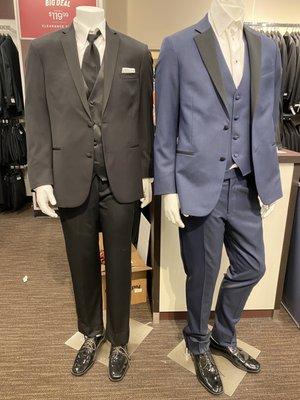 Mannequins dressed in suits.