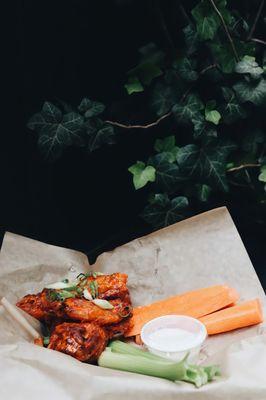 Classic Buffalo-style wings with creamy bleu cheese dressing on the side, with celery and carrots