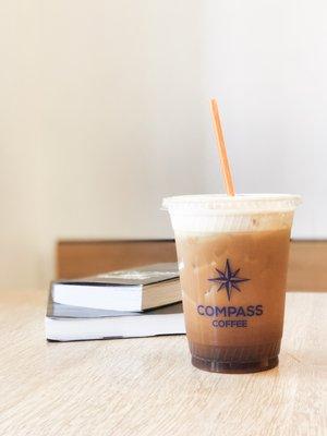 Compass Coffee Cold Brew with Cream and Books