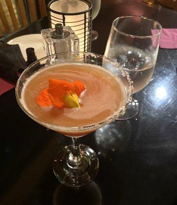 Blood orange martini (with edible blossom)