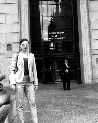 Elena Mindin Esq. in front of New York Supreme Court.