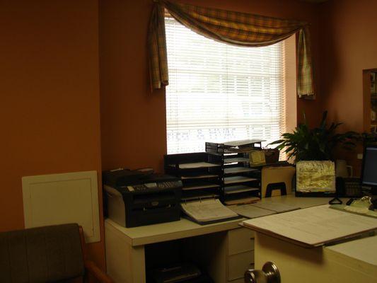 Receptionist's desk where intake forms are recorded privately and electronically.