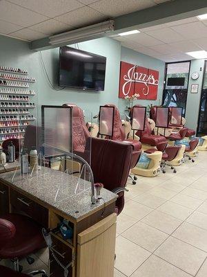 Our new normal with partitions between pedicure spa chairs