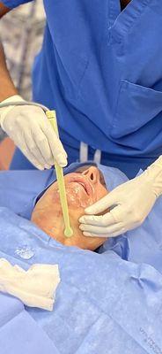 Dr. Nia Banks performing a surgerical procedure.