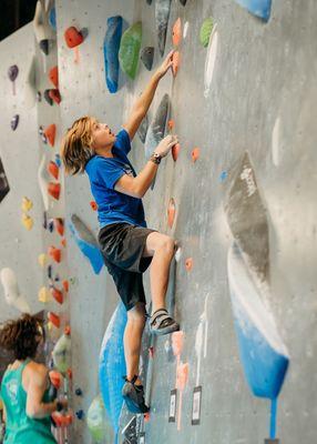 Climbing on the slab at Synergy Climbing And Ninja