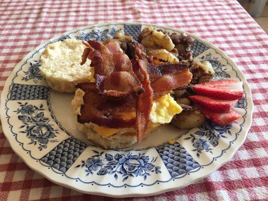 Biscuit breakfast sandwich with bacon which was cooked to perfection!