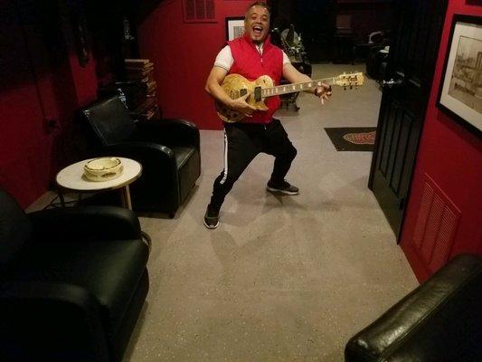 The owner Frank showing off his guitar signed by Quirro Fuento