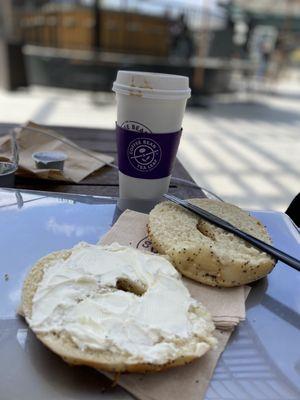 Bagel with cream cheese in decaf Americano