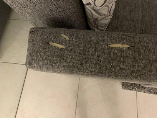 Stab/cut marks in couch arm